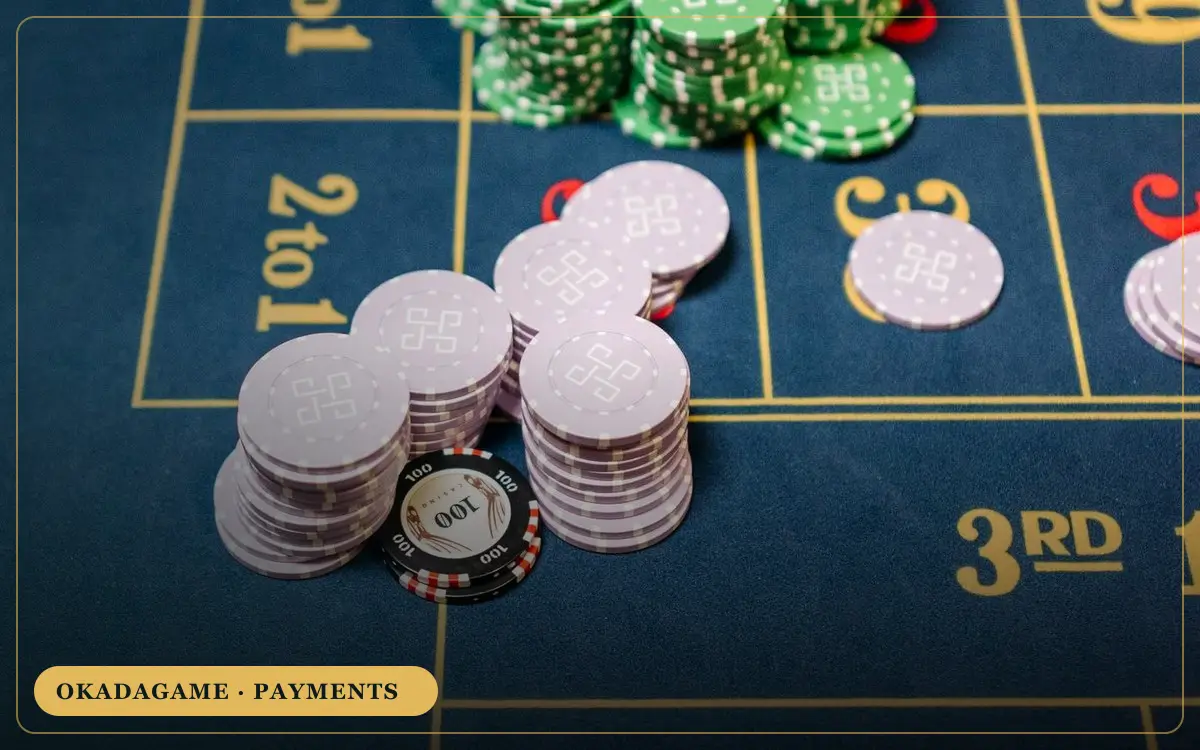 OKADAGAME payments – stacks of casino chips on a table